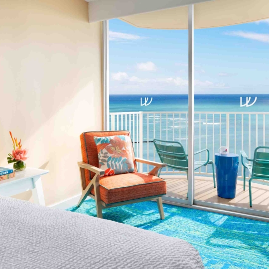 Waikiki ocean front hotel suite with lanai. Sleeps 4: one king bed and one sofa bed.