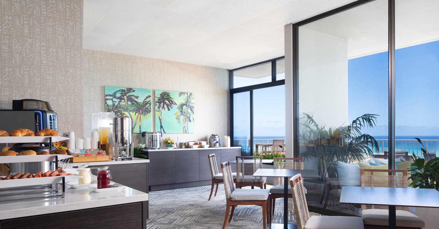 Coconut Club 9 interior tables with views of the ocean