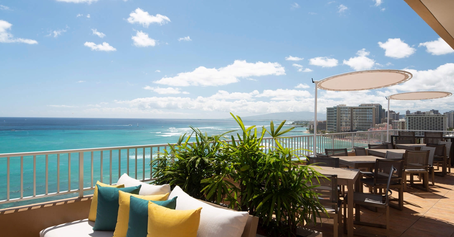 Coconut Club 10 interior tables with views of the ocean