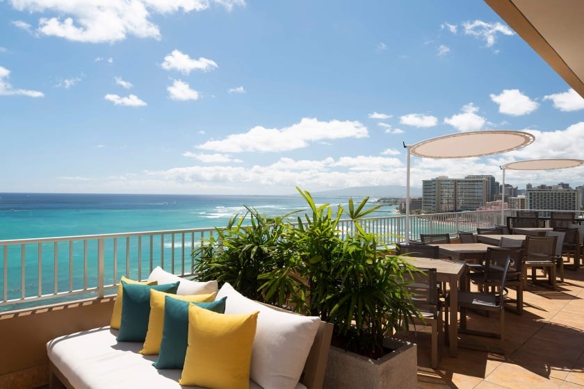 Coconut Club 10 interior tables with views of the ocean