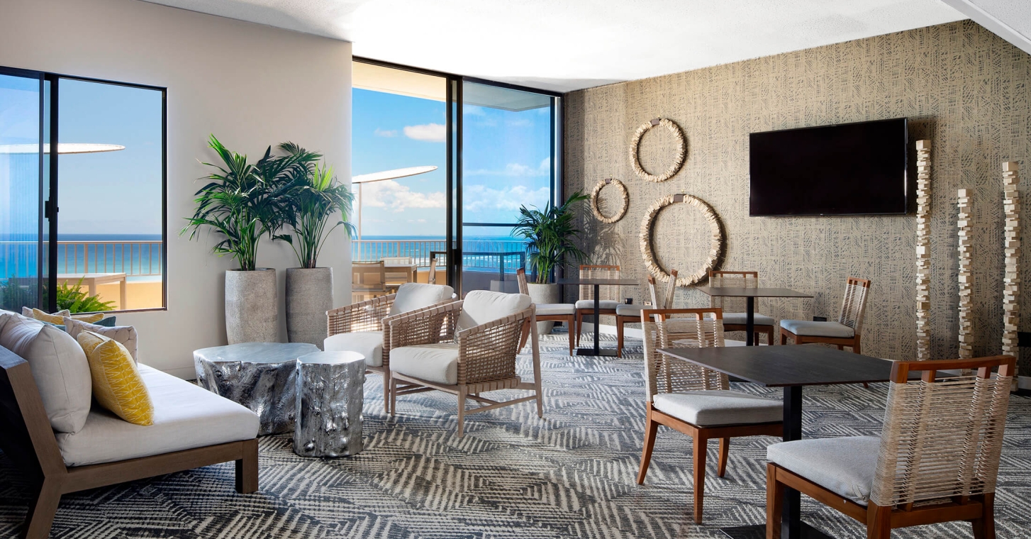 Coconut Club 6 interior tables with views of the ocean