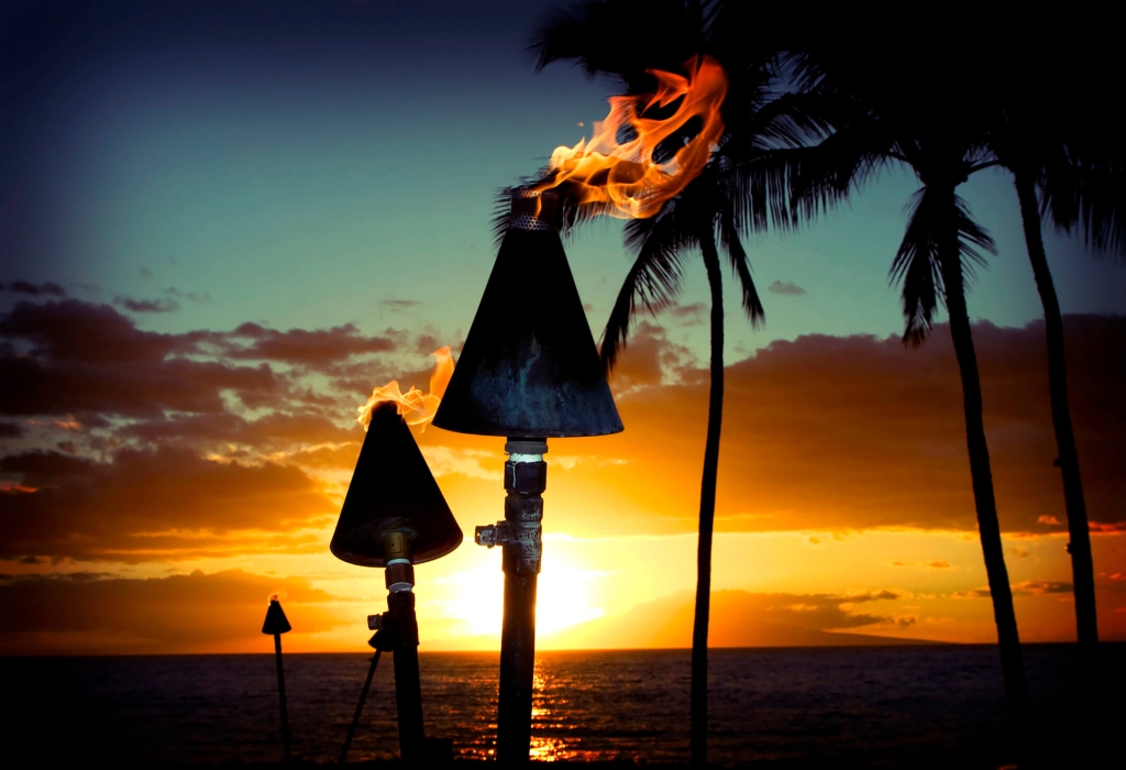 Tiki torches at sunset