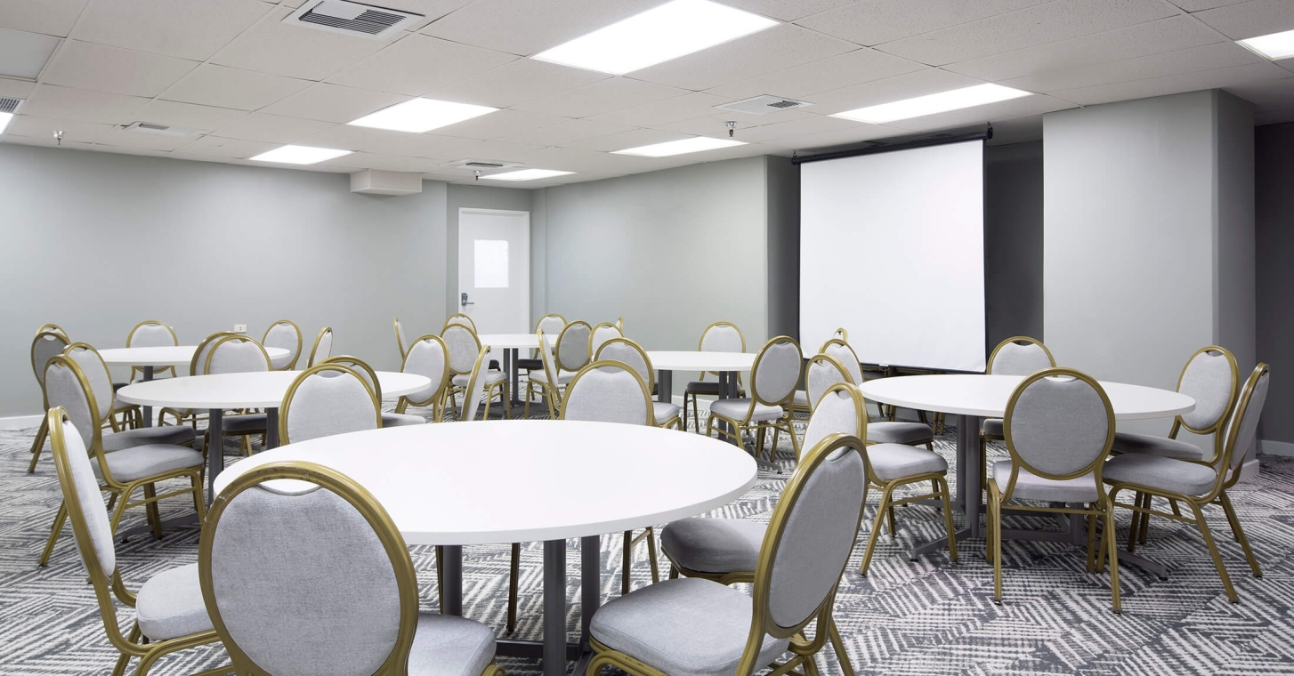 Lokahi Meeting Room 5 - round table setup with AV screen