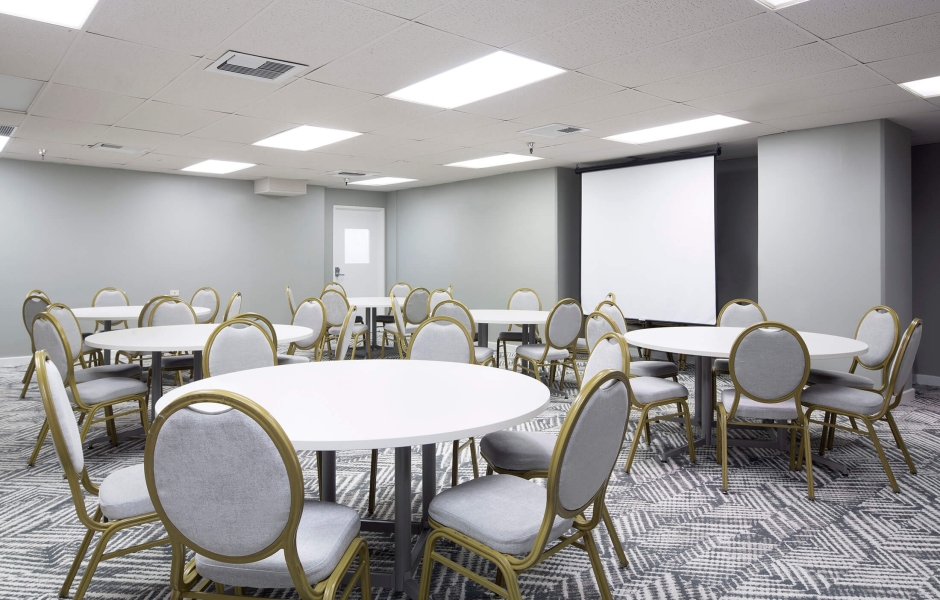 Lokahi Meeting Room 5 - round table setup with AV screen