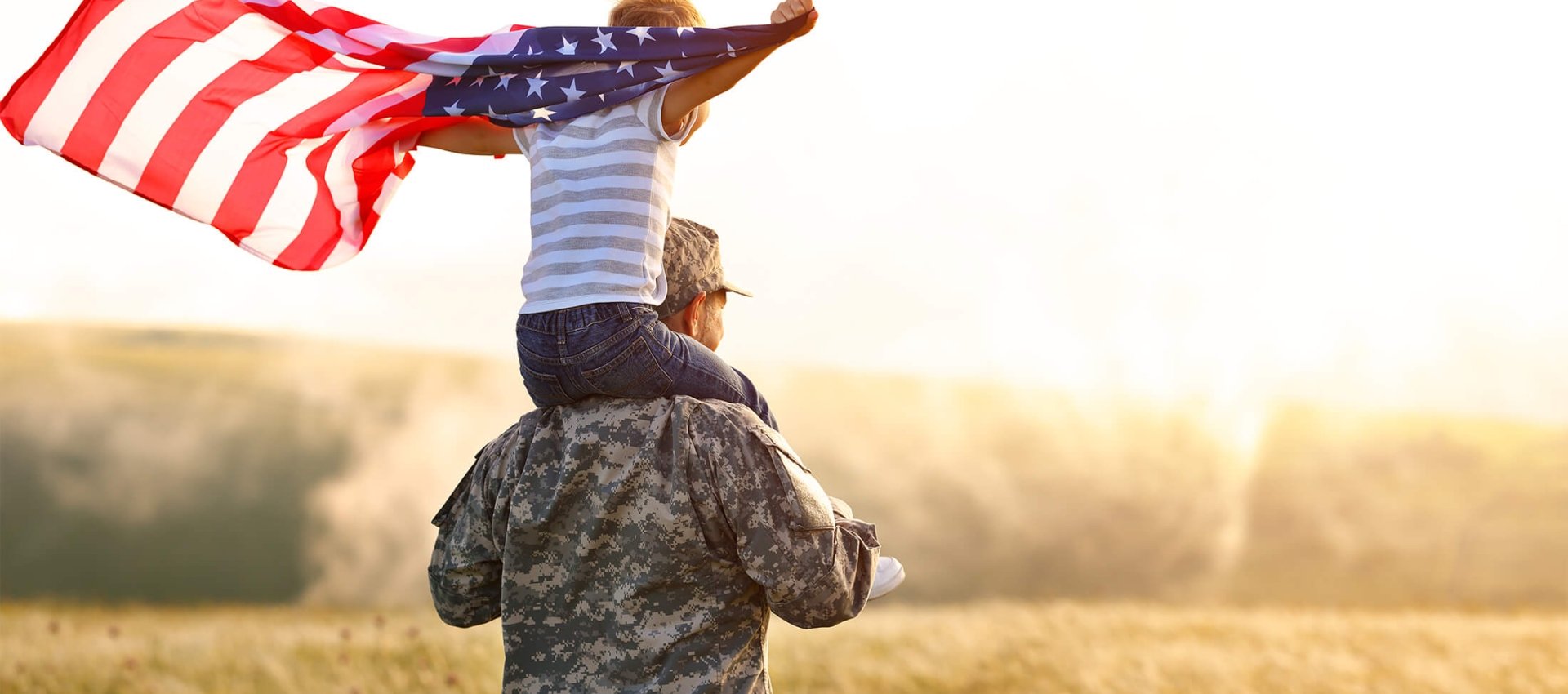 Soldier with child holding flag