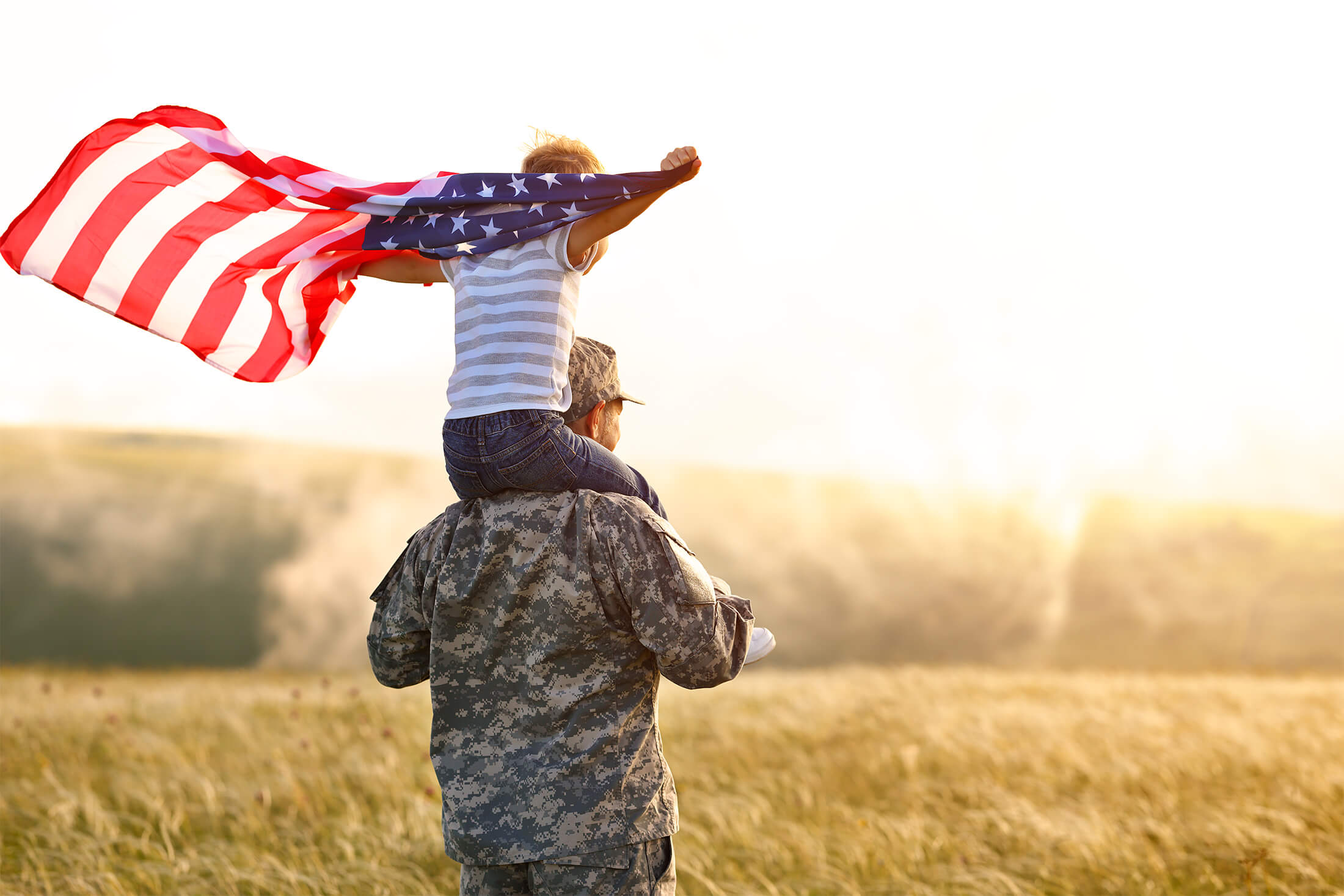 Soldier with child holding flag