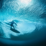 Surfer sitting on top of the water