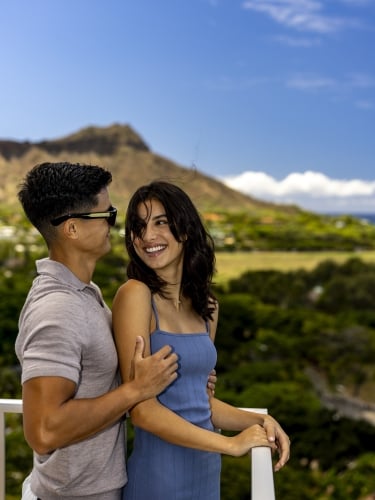 Couple smiling with Diamond Head Crater in background