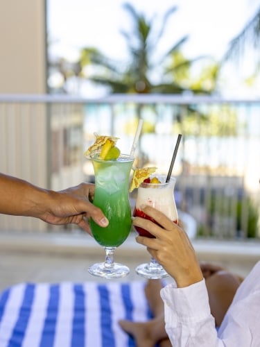Drinks with cocktail umbrellas mid cheers