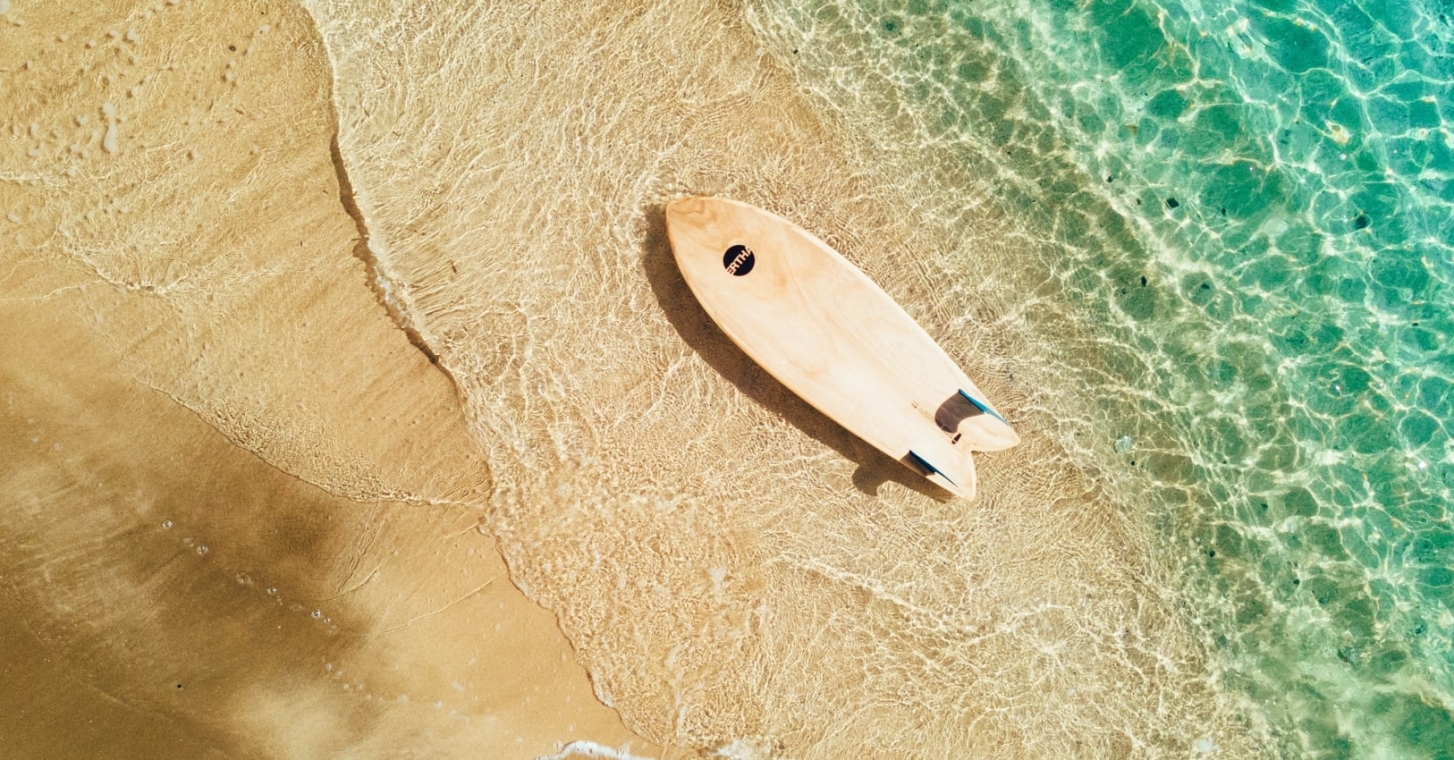 Arial photo of Surfboard on the beach