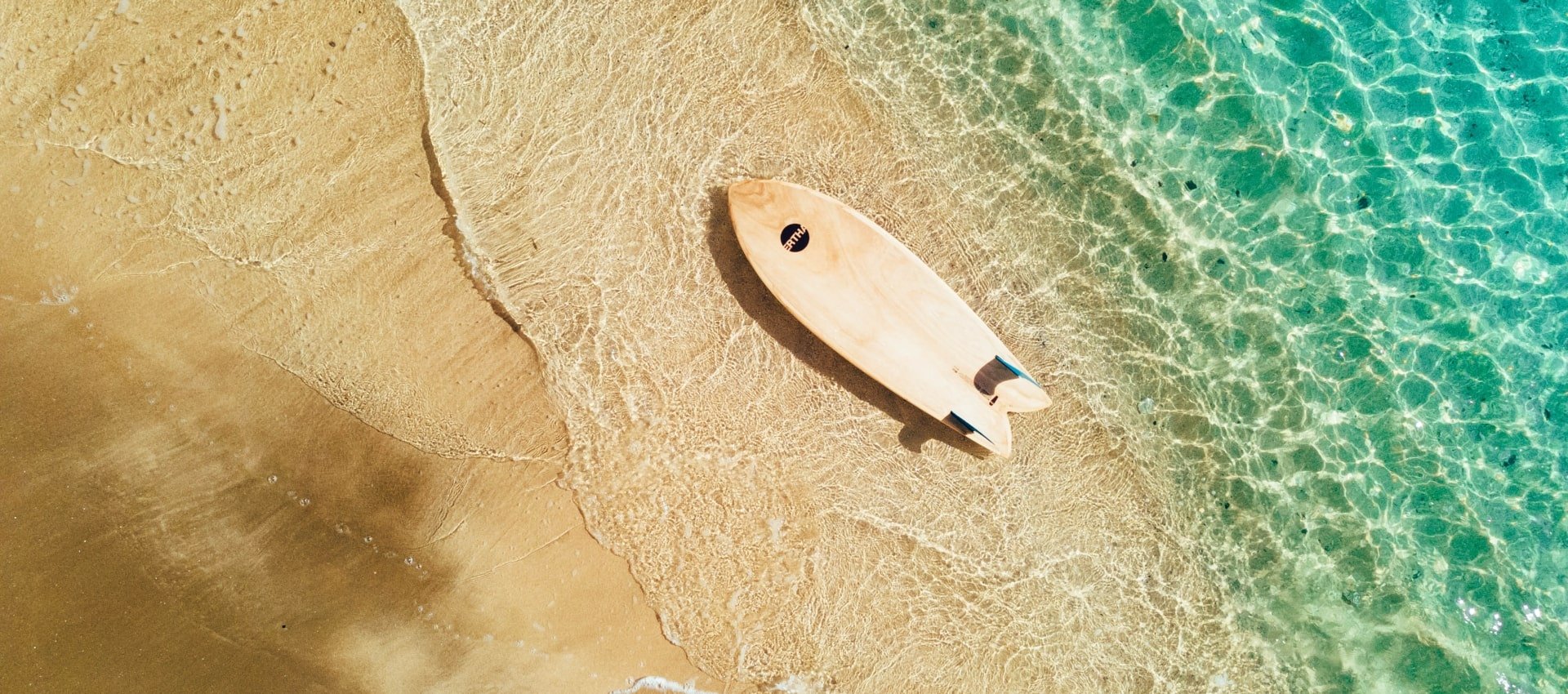 Arial photo of Surfboard on the beach