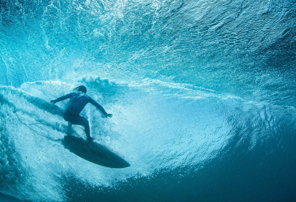 Surfer riding a wave in Waikiki