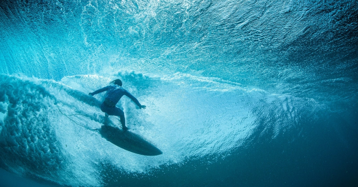 Surfer riding a wave in Waikiki