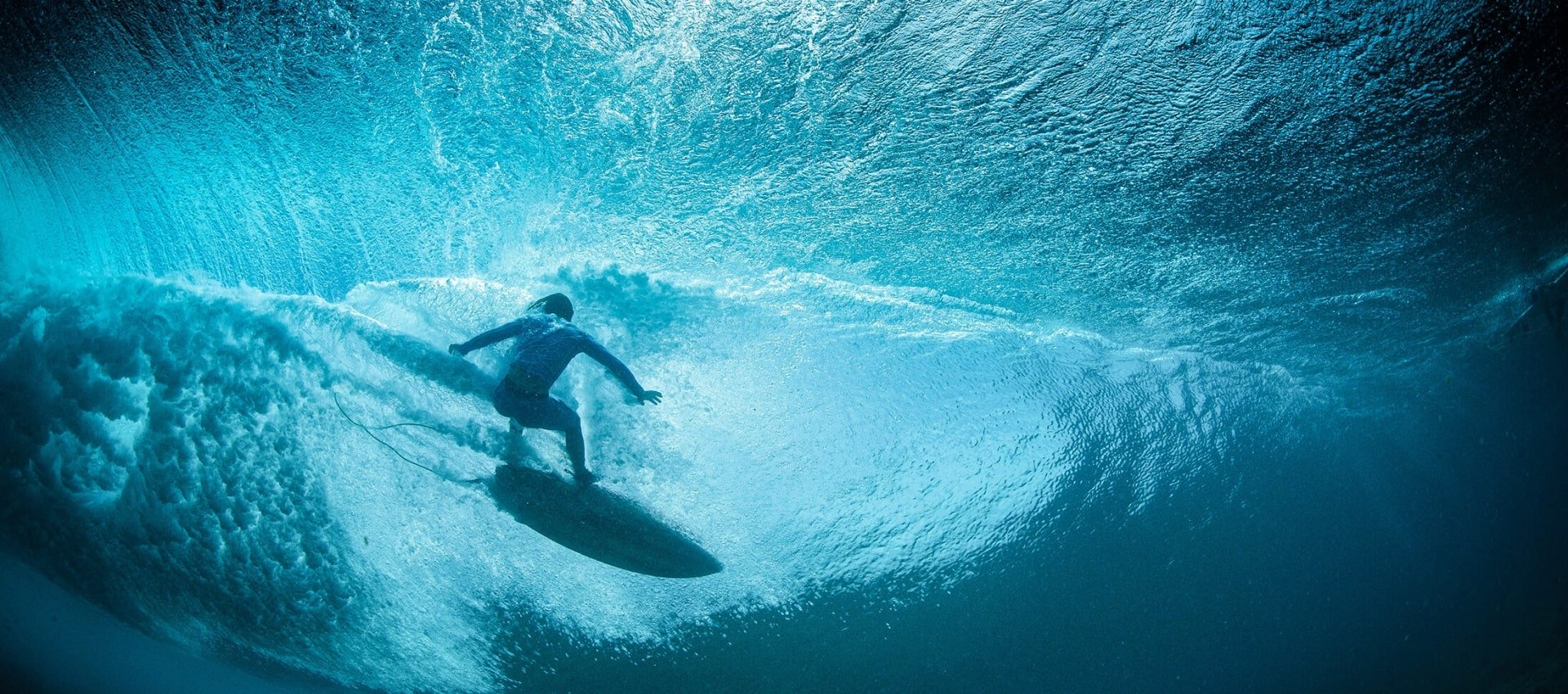Surfer riding a wave in Waikiki