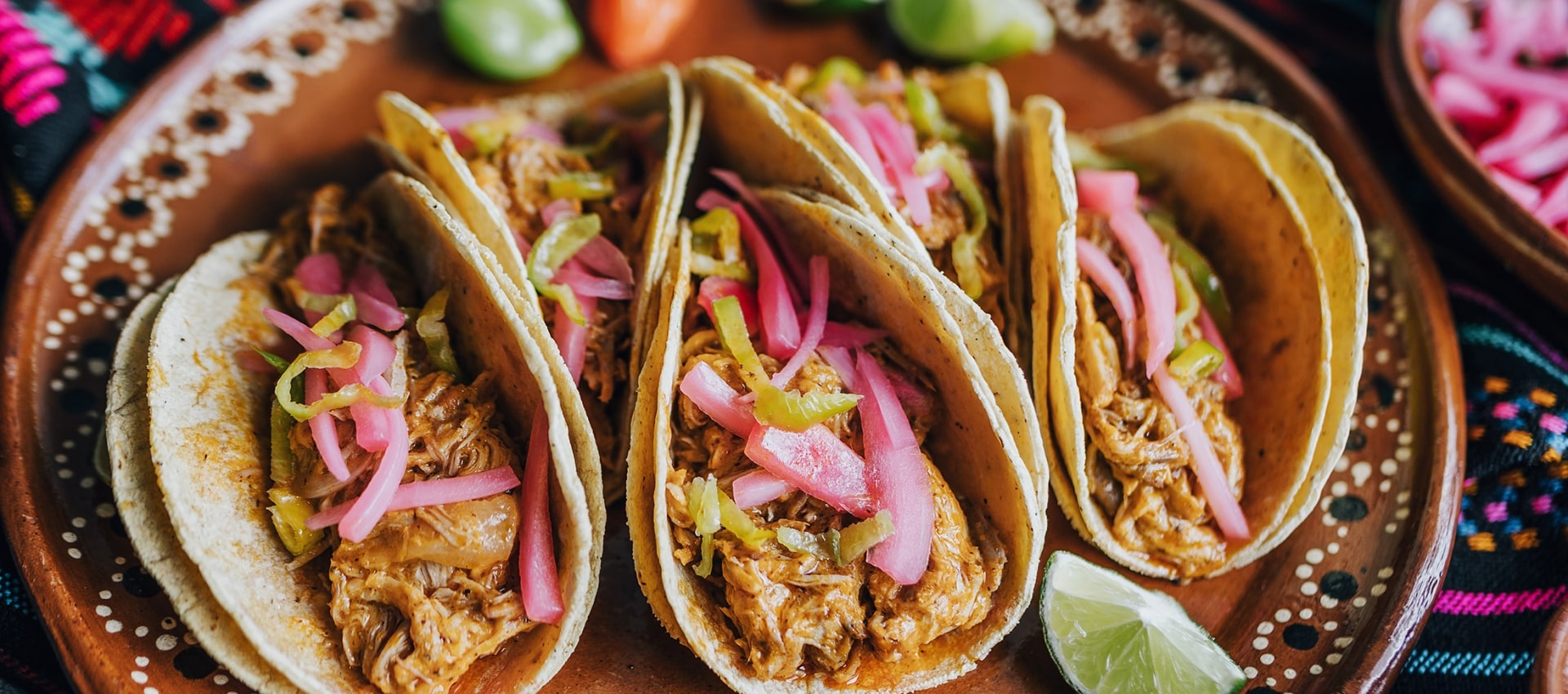 three soft tacos on a plate