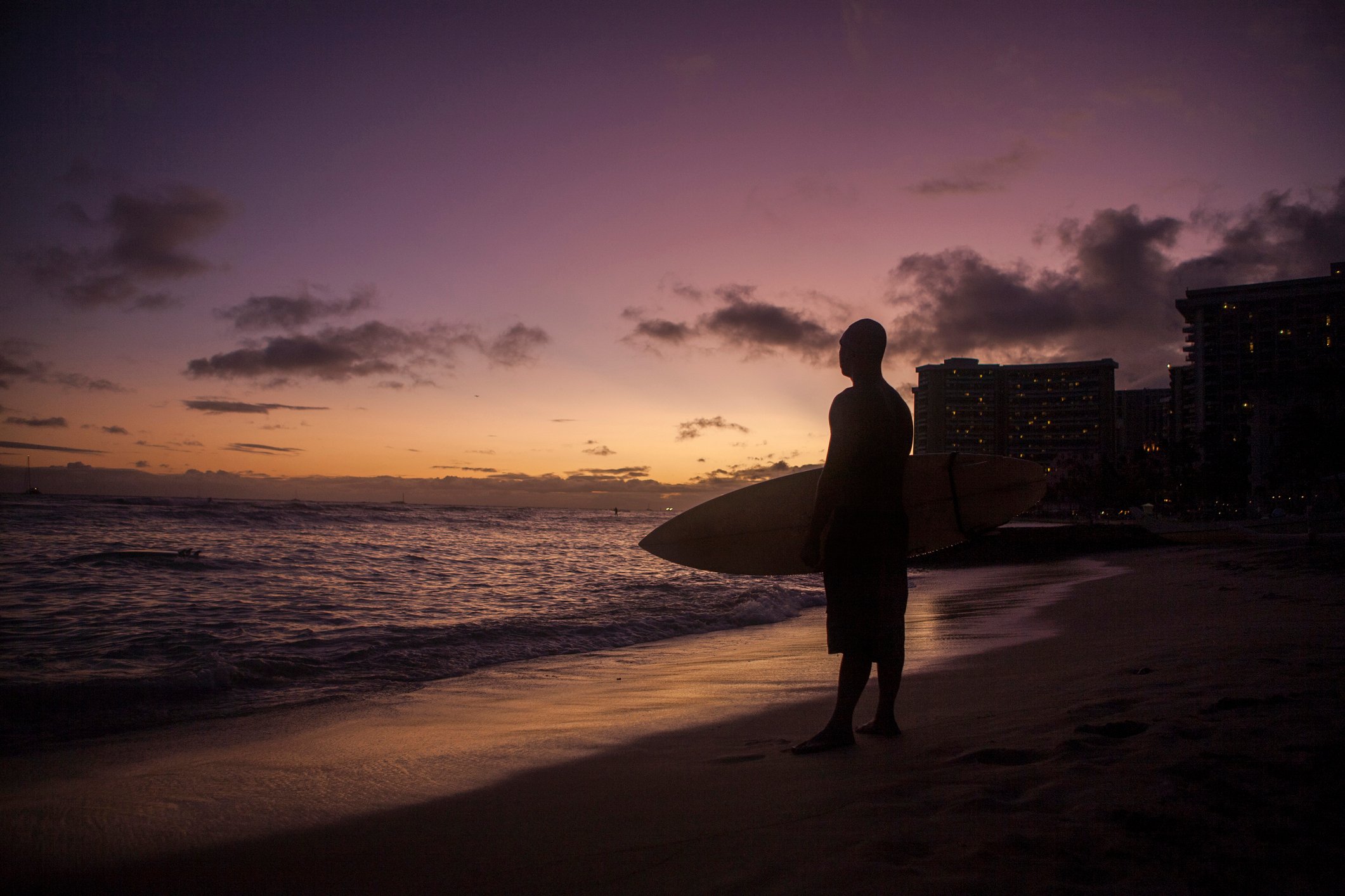 Silhouette of a surfer at sunset, Waikiki Beach