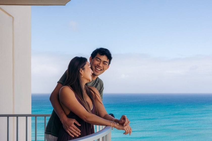Couple on balcony with ocean view